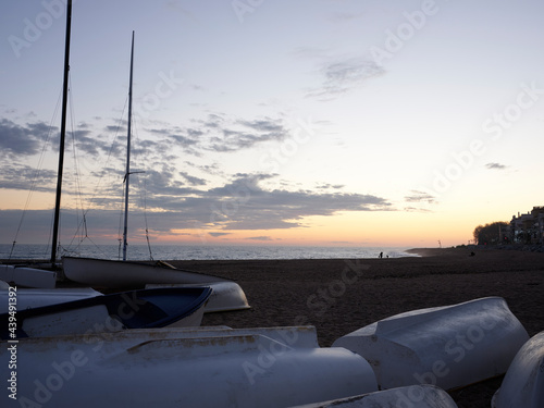 Boats on the  beach at sunset photo