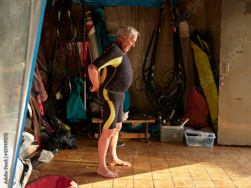Senior man with watersports suit