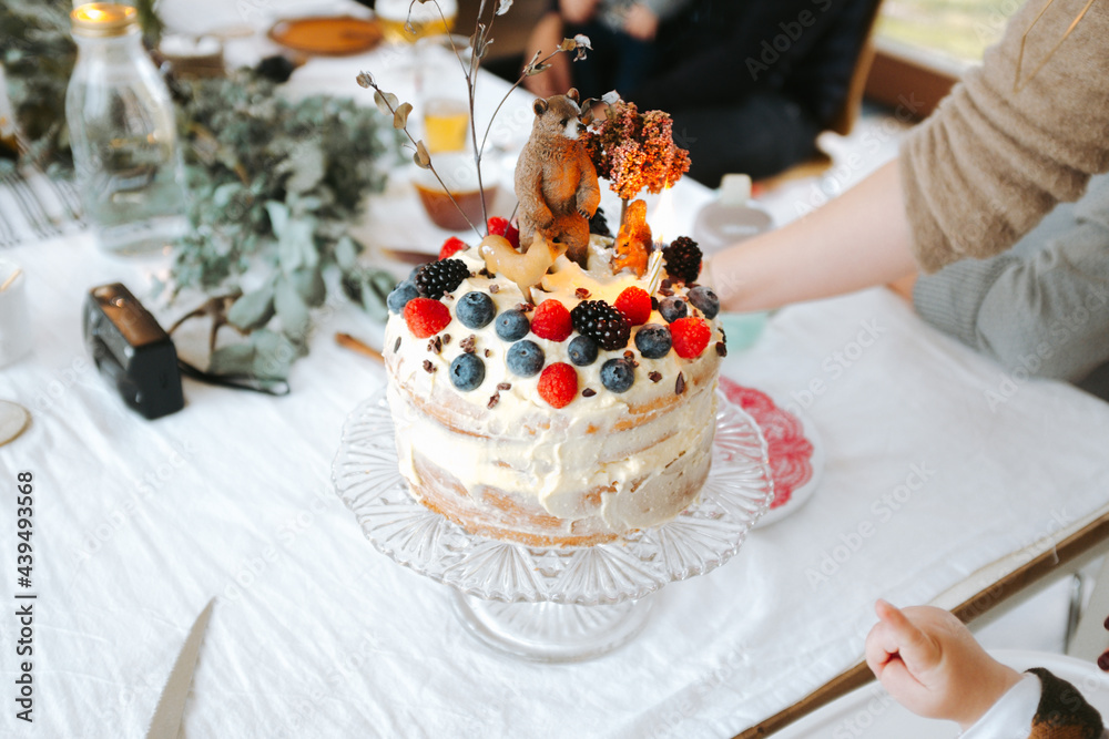 Birthday cake with forest theme on a table indoors Birthday cake with forest theme on a table indoors