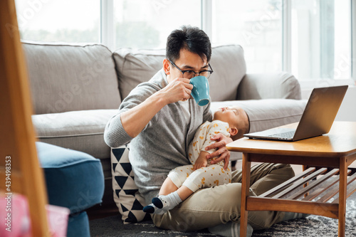 father and baby at home photo