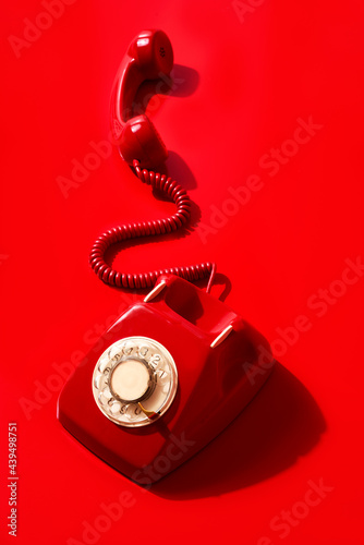 red rotary dial telephone