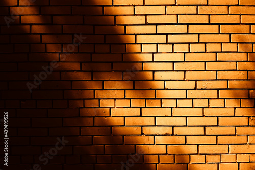 Shadows on brick wall texture background photo