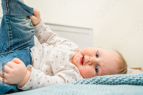 Portrait of a cute little baby girl in a bright room
