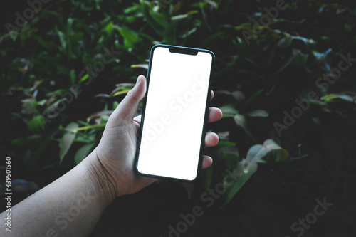 Studio shot of Business Hand holding Smartphone iPhone set and isolated on background for your mobile phone app or web site design, logo Global Business technology -include clipping path.