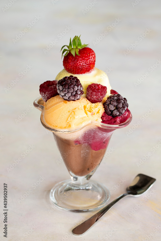Ice cream in glass bowl. Milk, chocolate, cherry, melon and caramel ice cream. Ice cream in glass bowl. Milk, chocolate, cherry, melon and caramel ice cream.
