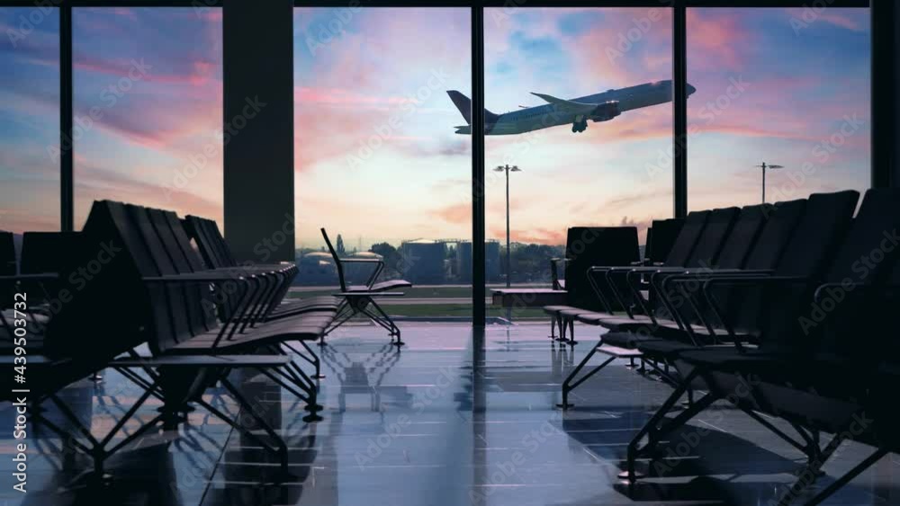 Airplane taking off seen through window. Sunset view from inside an empty terminal, waiting hall benches with no people or travellers in the lounge. Pandemic restrictions on flights and lockdown rules