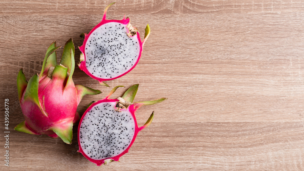 Dragon fruit or pitaya on wooden background, Tropical fruit, Table top view