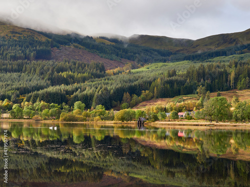 Sunrise reflections on Loch Lubnaig. Loch Lomond and the Trossachs. photo
