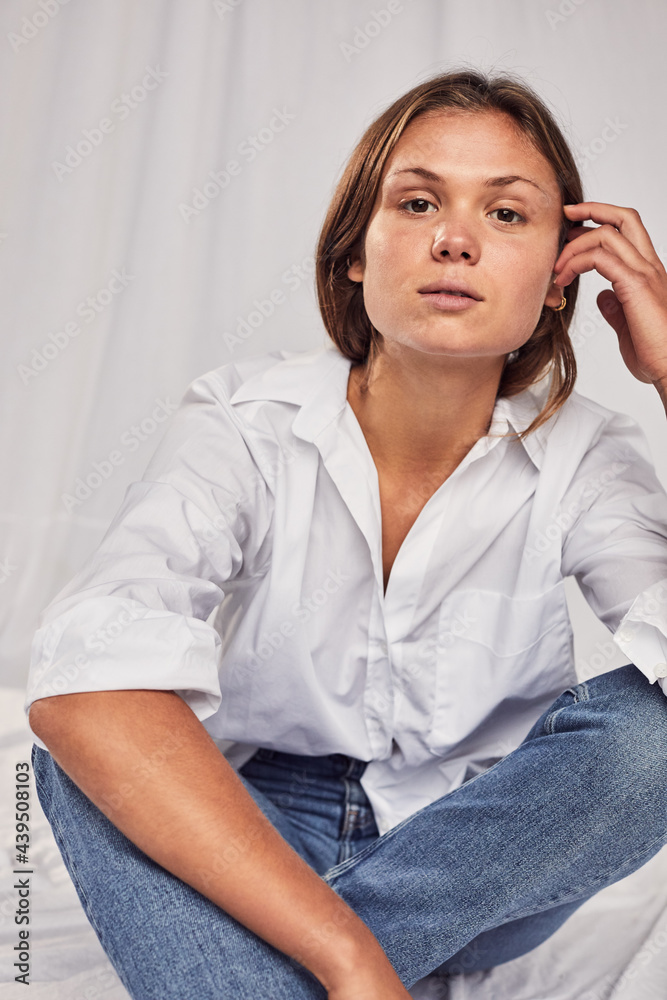 Casually dressed woman on a white backdrop Casually dressed woman on a white backdrop