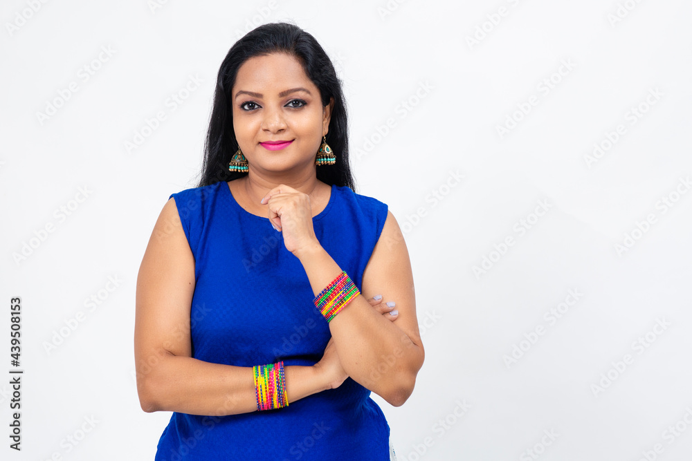 Indian female greeting with traditional Namaste, Woman folding palms, Pretty woman smiling, Portrait of beautiful brunette young woman. Indian female greeting with traditional Namaste, Woman folding palms, Pretty woman smiling, Portrait of beautiful brunette young woman.