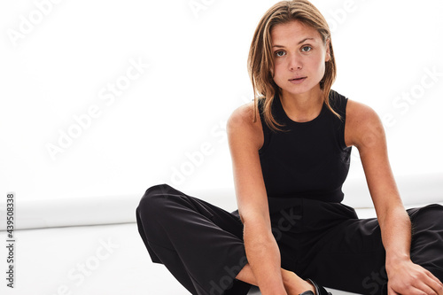 Fashionable young woman on a white background