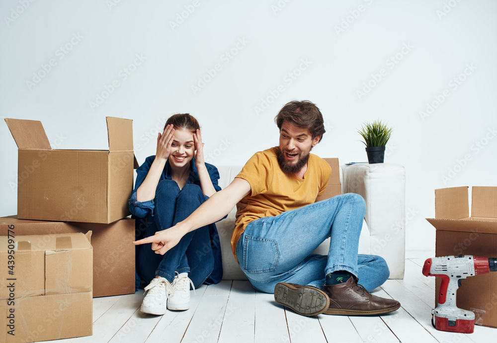 Young family boxes with things moving housewarming Young family boxes with things moving housewarming