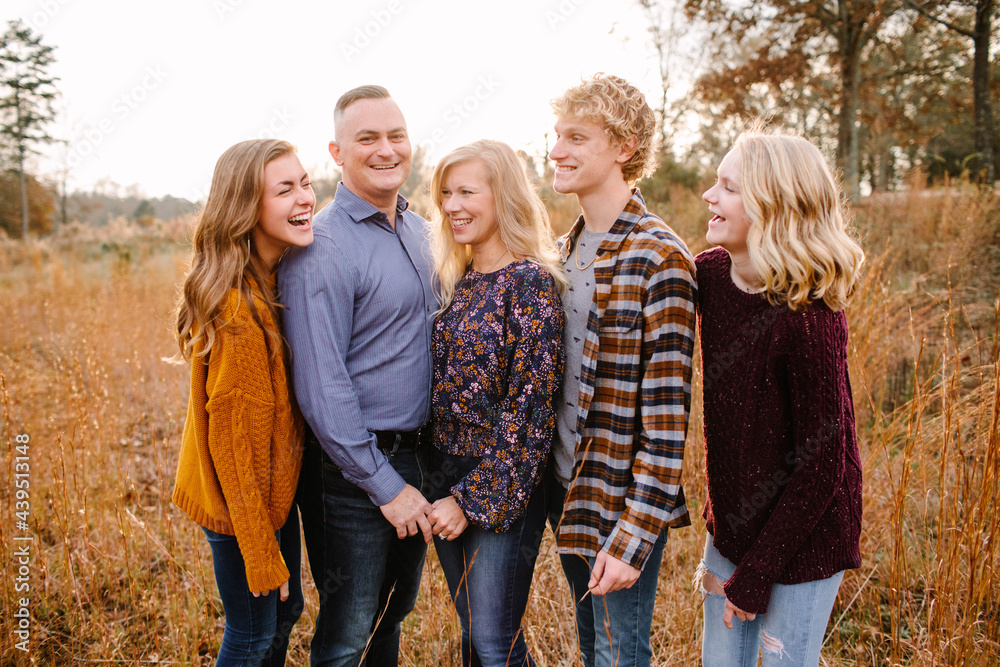 Happy Family with Teenagers Looking at Each Other Happy Family with Teenagers Looking at Each Other
