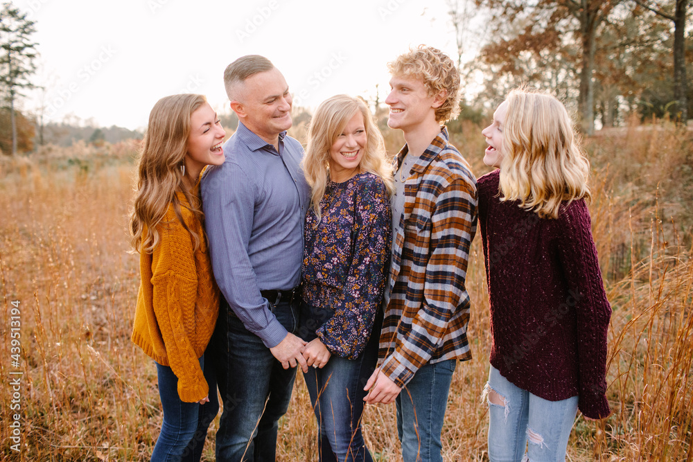 Happy Family with Teenagers Looking at Each Other Happy Family with Teenagers Looking at Each Other