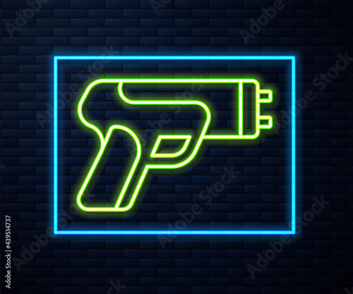 Glowing neon line Police electric shocker icon isolated on brick wall background. Shocker for protection. Taser is an electric weapon. Vector