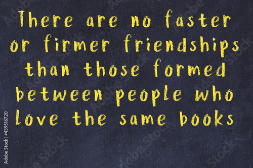 Black chalkboard with wise inscription on it