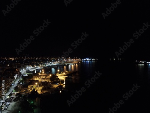 Aerial Night View Of Cruise Ships In Port Station Of Igoumenitsa City In Greece