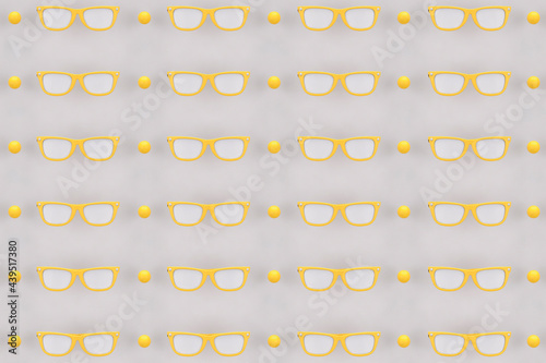 bird eye view of Yellow sunglasses on grey background photo