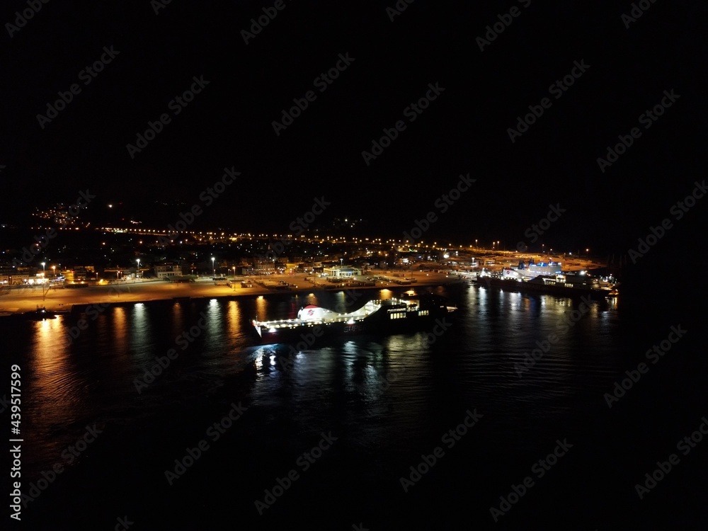 Aerial Night View Of Cruise Ships In Port Station Of Igoumenitsa City In Greece