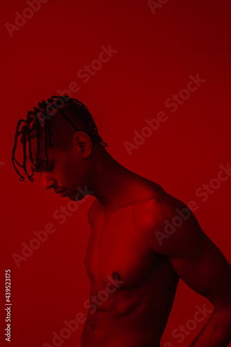 Man Shirtless In Red Room photo