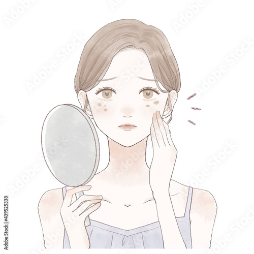 顔のシミに悩む女性