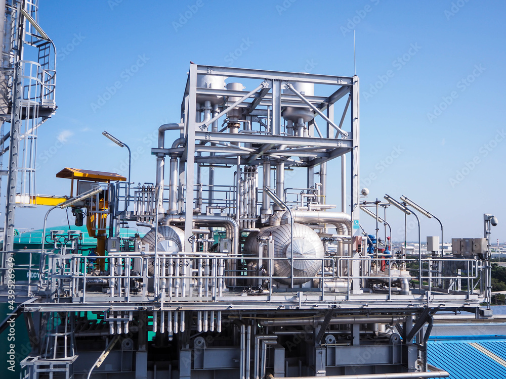 Heat recovery steam generator and sky in Combined-Cycle Co-Generation Power Plant which it so beautiful and popular to background power plant concept. Heat recovery steam generator and sky in Combined-Cycle Co-Generation Power Plant which it so beautiful and popular to background power plant concept.