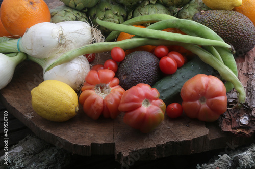 onions tomatoes artichockes avocados and healthy food products photo