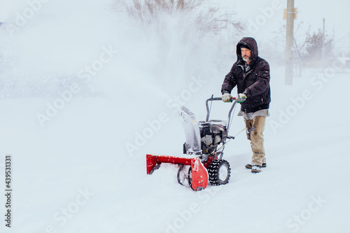 Man with snowblower  photo