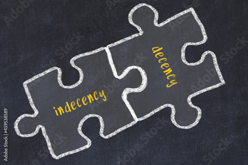 Ploblem solving. Chalk sketch of two puzzles with words indecency and decency