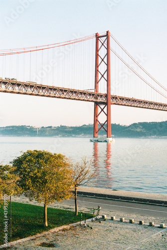 Suspensial bridge through the river in Lisbon photo