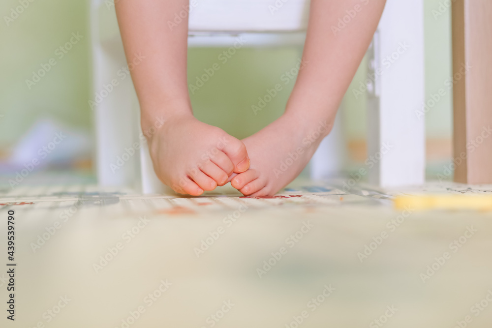 baby feet sitting on a chair baby feet sitting on a chair