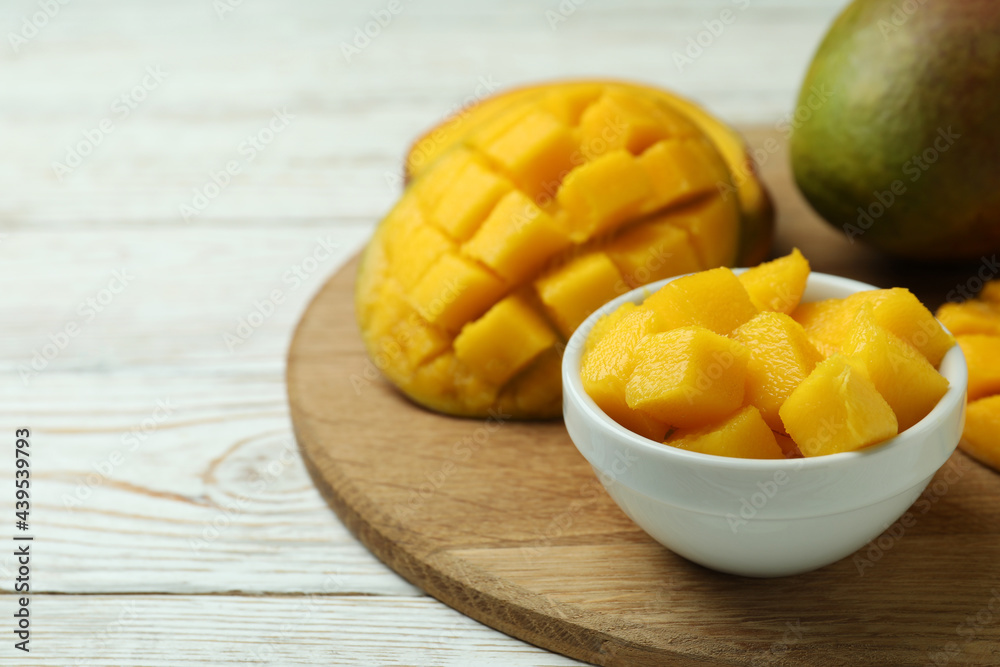 Tasty ripe mango fruit on wooden table Tasty ripe mango fruit on wooden table