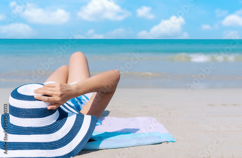 Konstfotografi Happy traveler Asian woman enjoy sunbathing at tropical beach on vacation