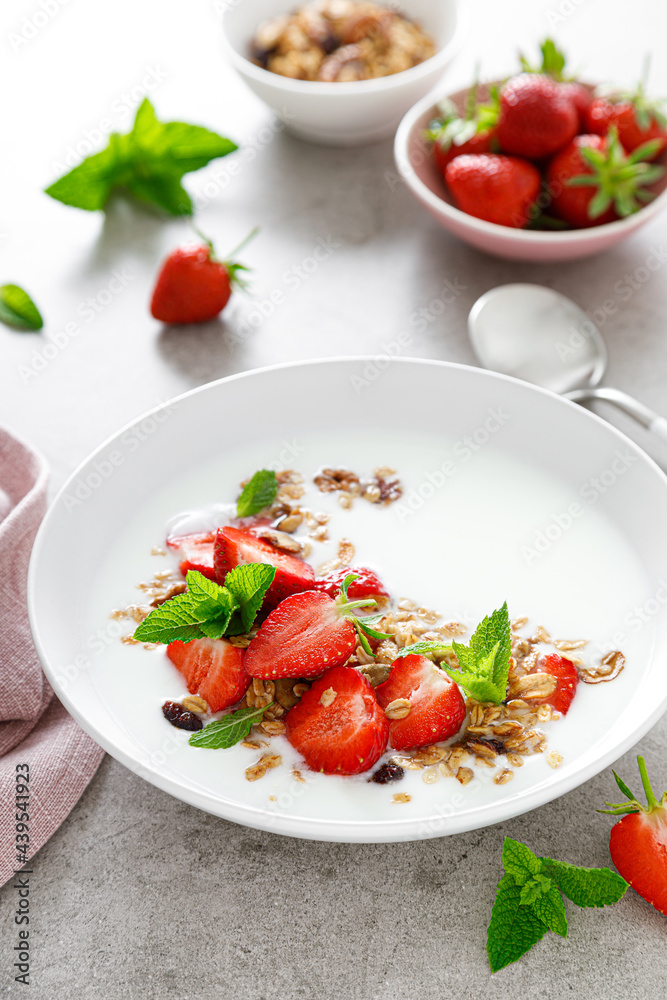 Strawberry granola with greek yogurt, nuts and fresh berries for breakfast Strawberry granola with greek yogurt, nuts and fresh berries for breakfast