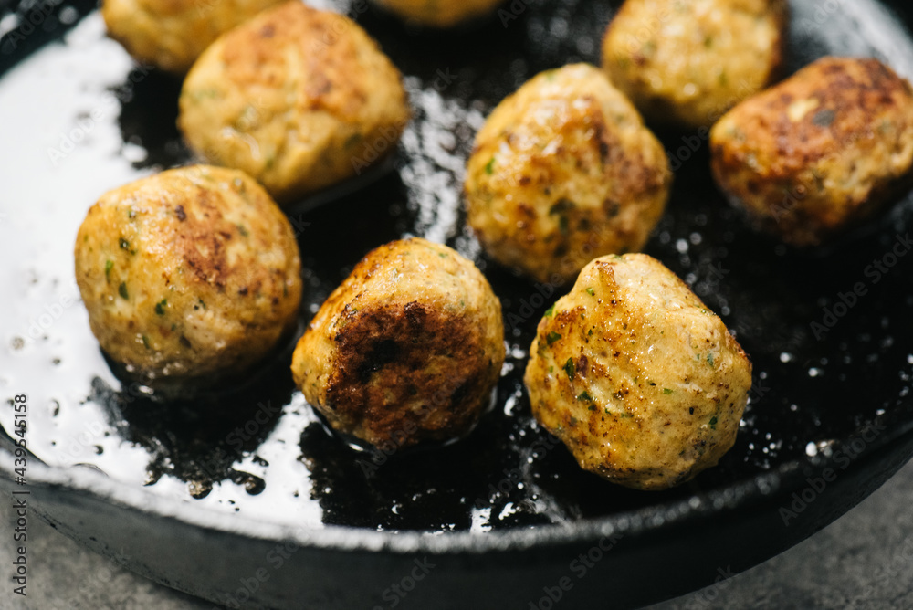 Chicken Shawarma Meatballs cooking in a cast-iron skillet Chicken Shawarma Meatballs cooking in a cast-iron skillet