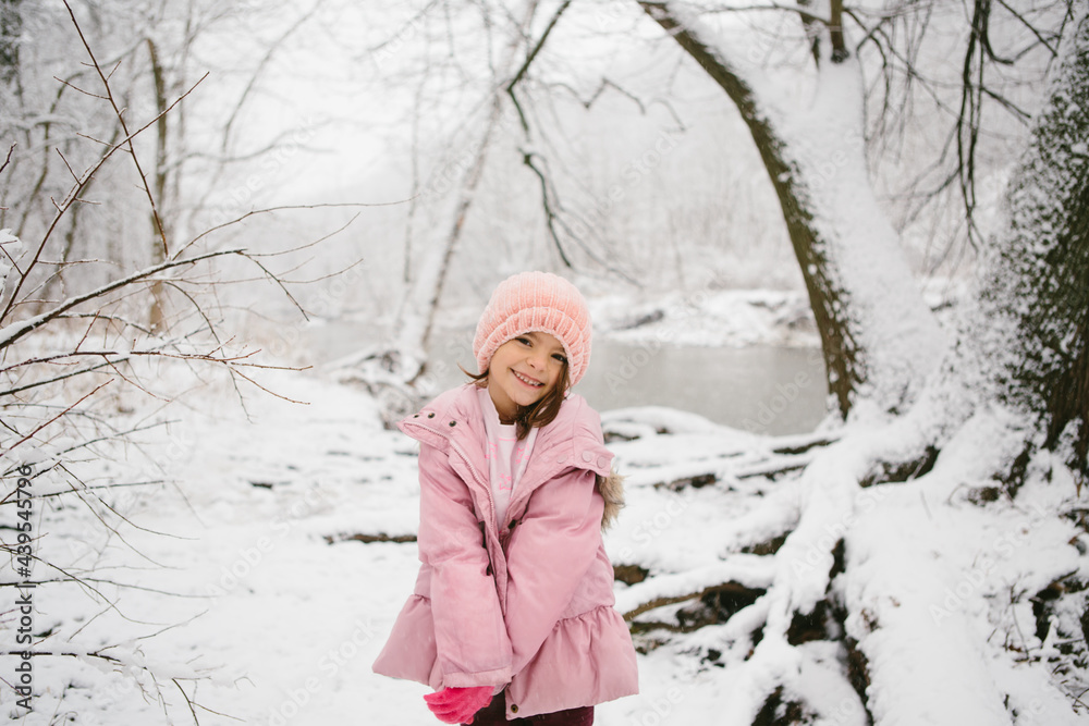 girl poses in snowy woods girl poses in snowy woods