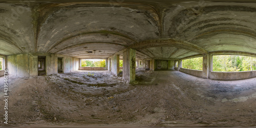 Spherical 360 degree panorama of room in abandoned building with shabby walls and ceiling with window and door openings. Full equirectangular projection for virtual reality or VR.