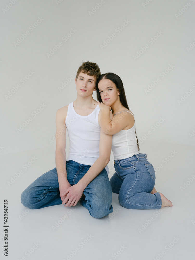 Androgynous man and Young dwarf woman in studio Androgynous man and Young dwarf woman in studio