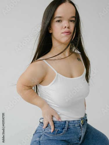Young dwarf woman with tattoo photo