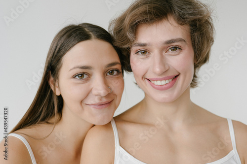 Happy women with different hairstyle looking at camera photo