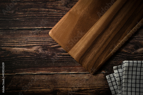 wooden cutting board on the dark wood kitchen