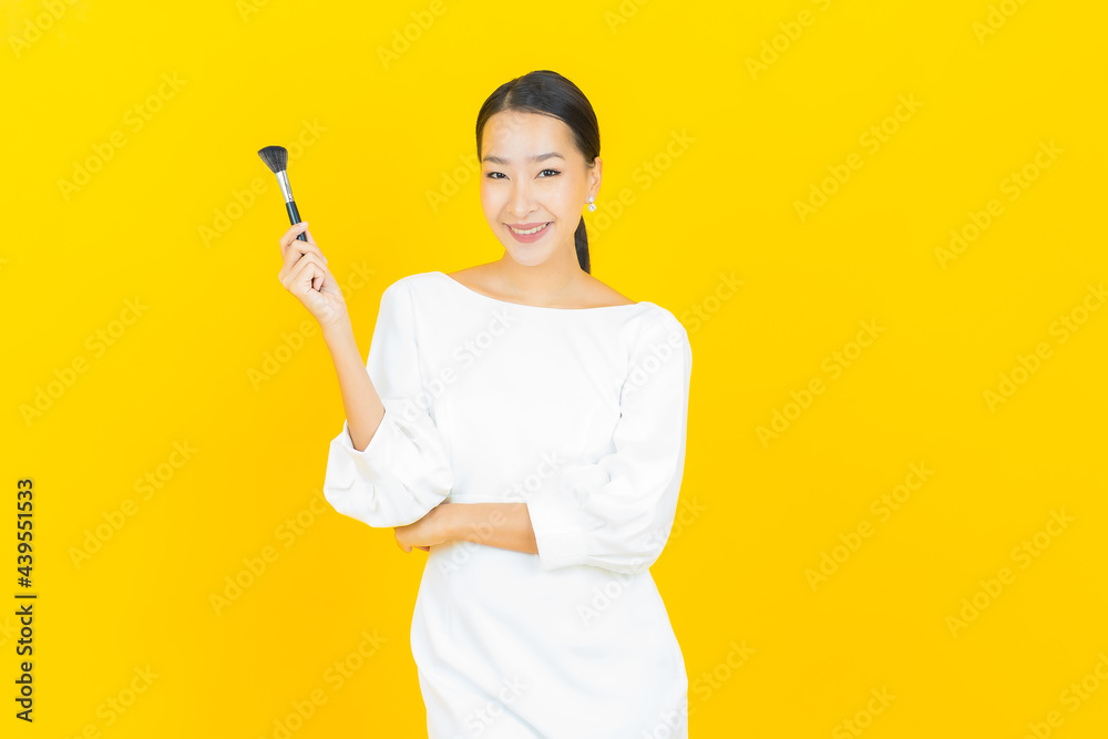 Portrait beautiful young asian woman with make up brush cosmetic Portrait beautiful young asian woman with make up brush cosmetic