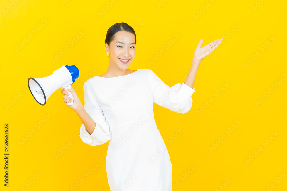 Portrait beautiful young asian woman smile with megaphone Portrait beautiful young asian woman smile with megaphone