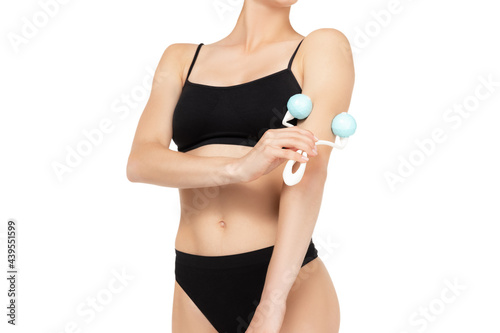 Woman's arm holding dry brush to top of her hands