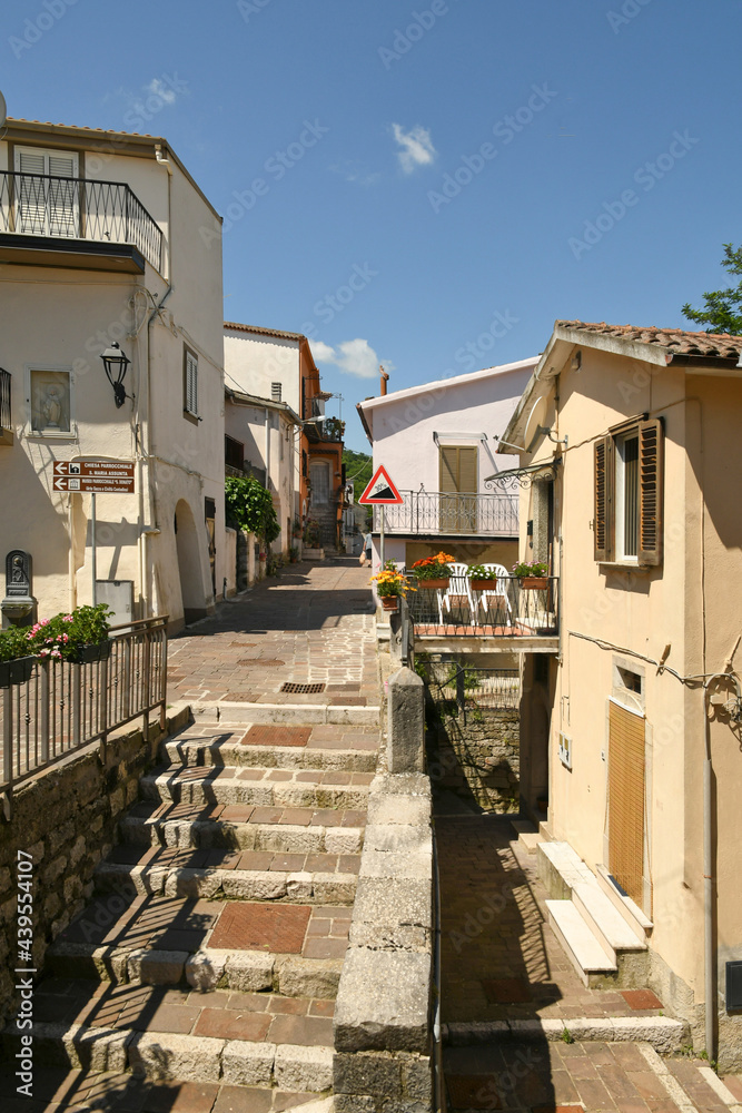 Ruvo del Monte, Italy, June 12, 2021. A narrow street among the old houses of a medieval village in the Basilicata region.