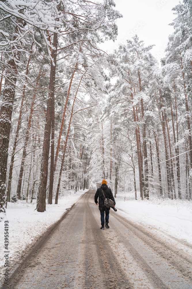 Man With Camera Walking On Snowy Path Man With Camera Walking On Snowy Path