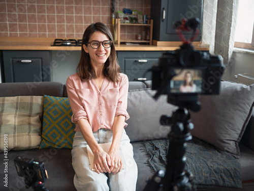 Woman recording video at home