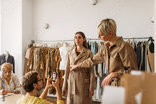 A Woman Fitting a Coat 