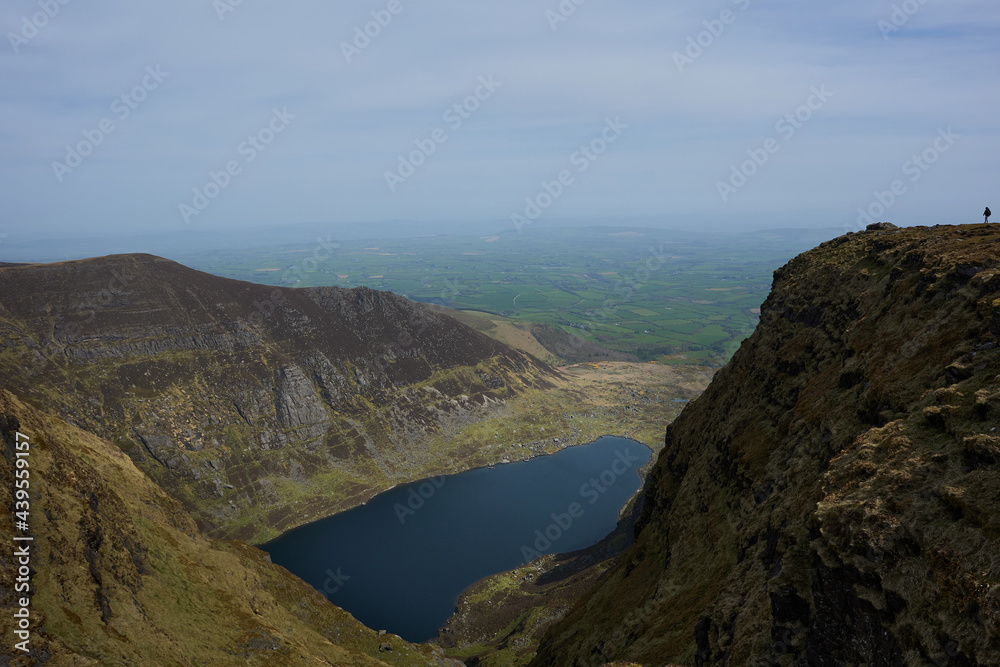Lake buried in beautiful mountains in the beginning of spring with a clear sky. Comeragh Mountains, Waterford, Ireland