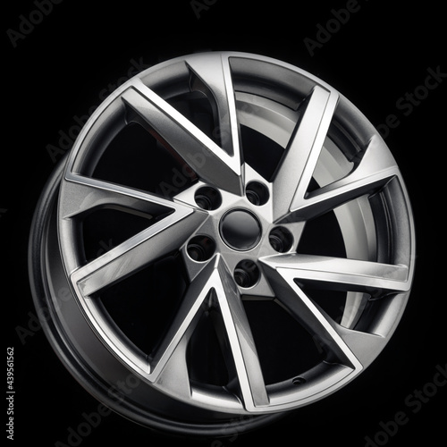 car alloy wheel, unusual strange design of wheel spokes, color gray with polishing